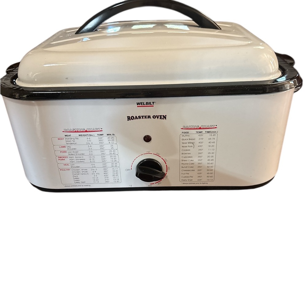 White Roaster Oven never used still has book to it.